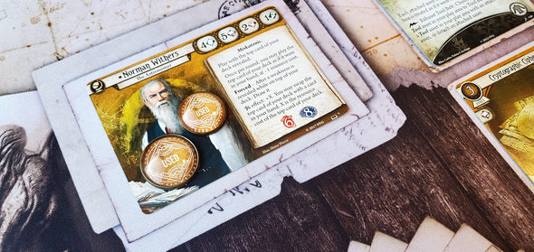 Arkham Horror LCG yellow Used tokens in 18 mm and 20 mm size on Seeker Investigator Norman Withers's card, showing that his once a round ability has been used.